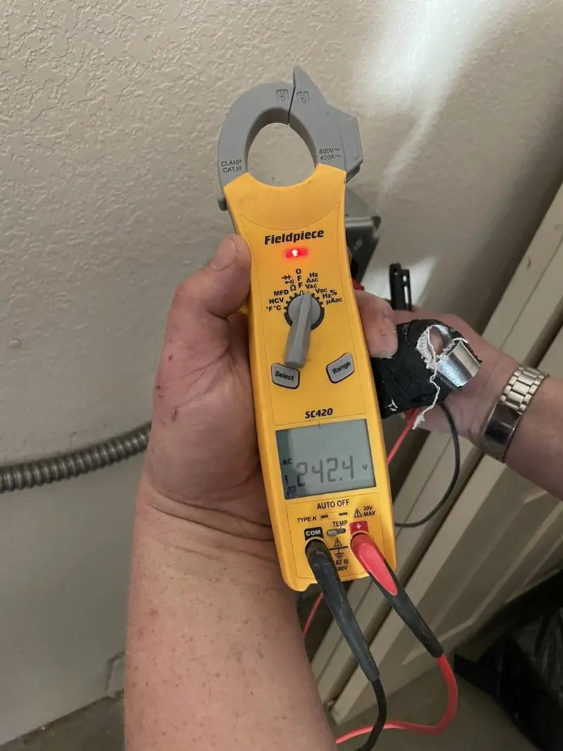 Voltage testing with clamp meter during Recessed Lighting Installation in Sheridan